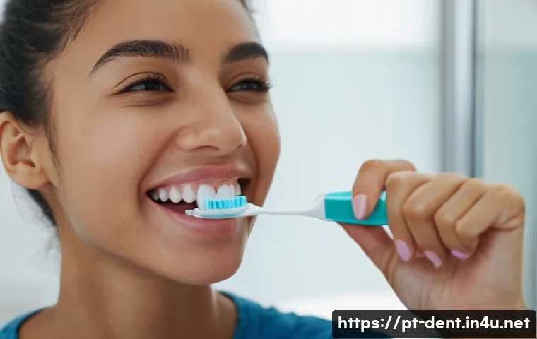 잇몸 출혈 원인과 치과 진료 필요성 - A detailed close-up image of a young adult woman of Brazilian descent smiling while brushing her tee...